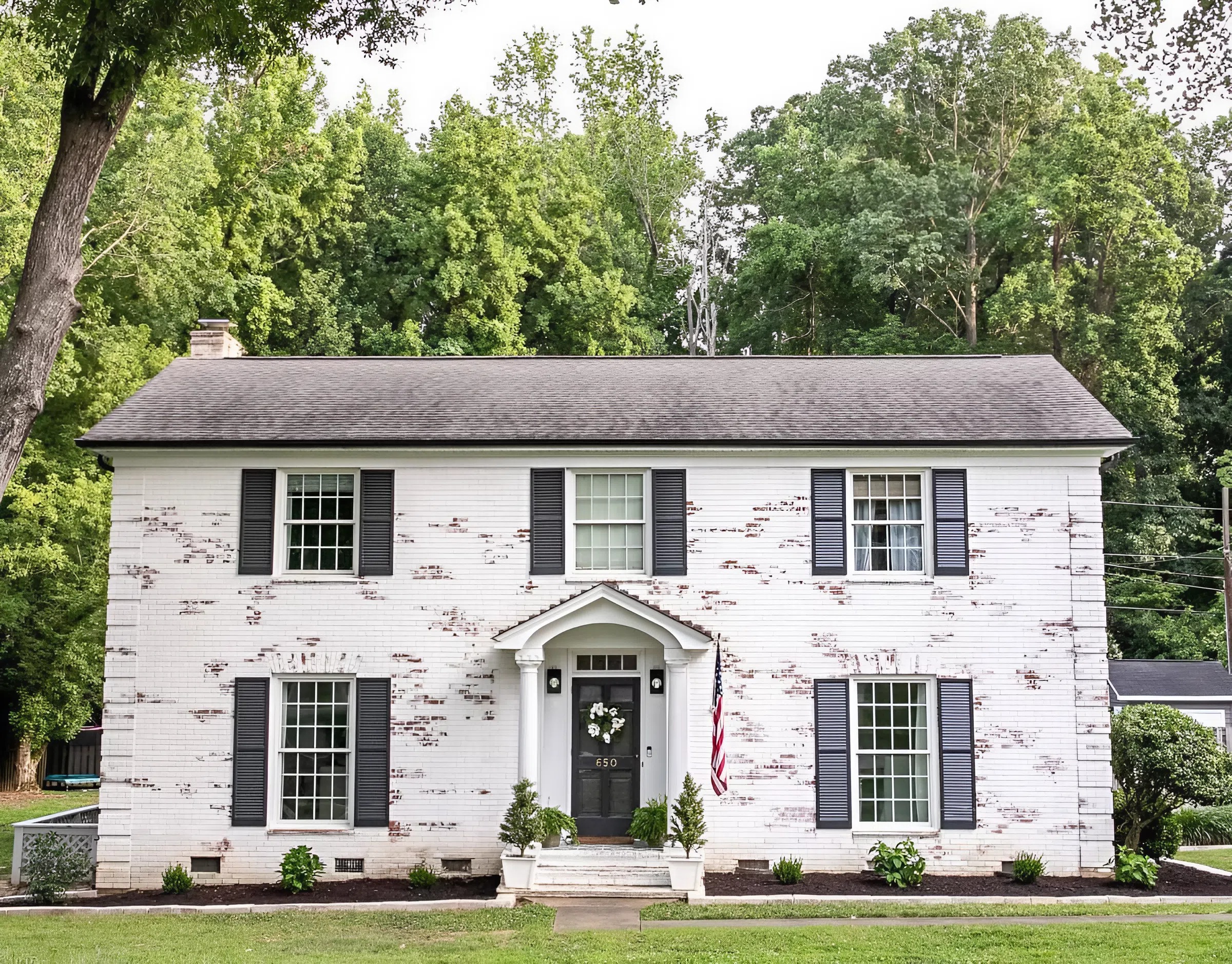 Exterior brick home with a soft white limewash finish by a house painter in Lewis Center, OH