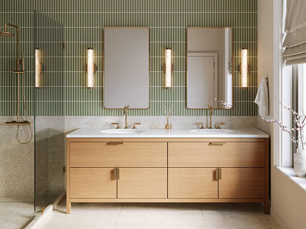 Bathroom with soft olive green painted accent wall and crisp white trim by a house painter in Bexley, OH.