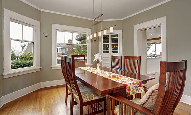Dining room with sage green walls and eggshell paint finishes by a house painter in Grandview, OH.